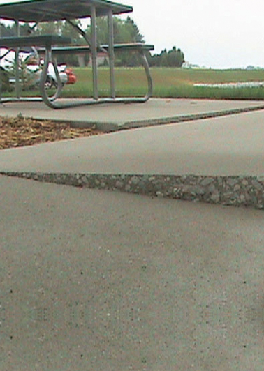 Example of a sidewalk that needs repair - Atlas Foundation Repair