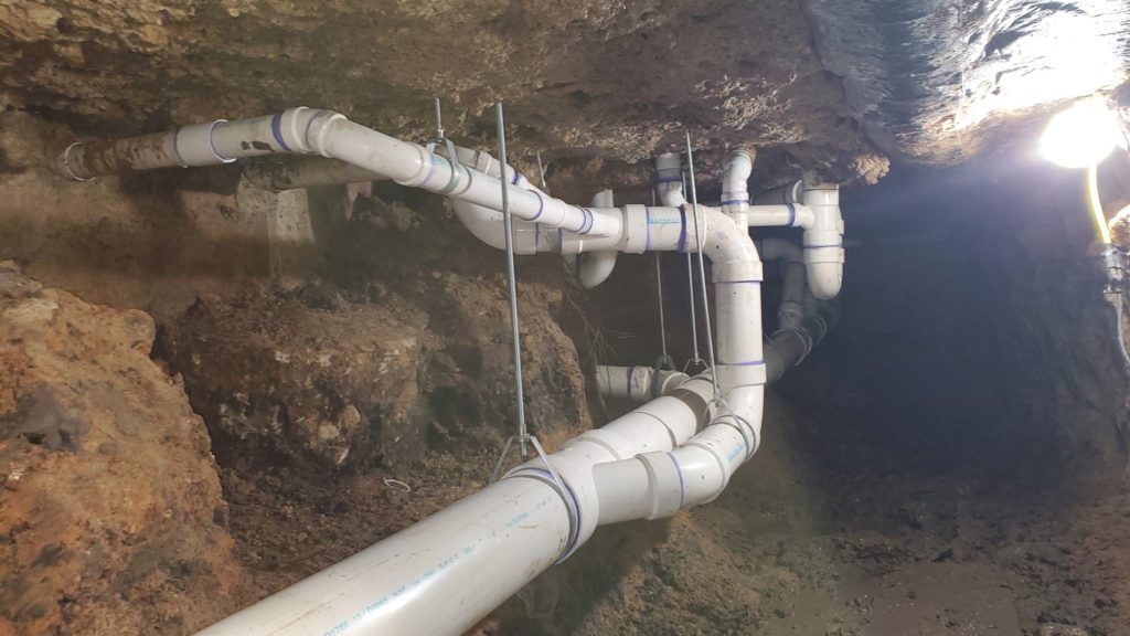 under slab plumbing under srip center in houston, tx